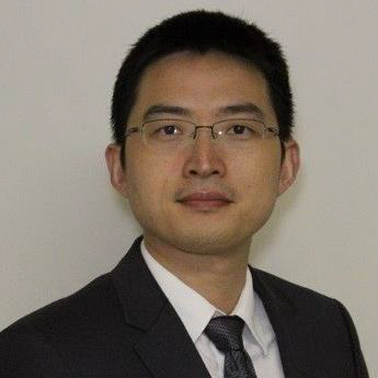 A headshot of Ming Xiao, PhD wearing a dark suit with a white button-up and dark tie