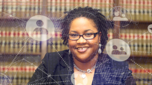 A woman in a business suit in front of legal textbooks